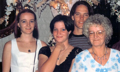 Diana Kupke and her children, Suzanne (Grima) and Amanda (Smith) with Nicolas Kupke at the rear.