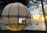 A globular treehouse at the beach