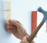 Use a comb to hold a nail in place