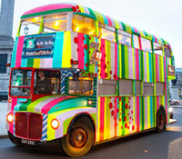Diana Kupke presents a knitted bus in Britain