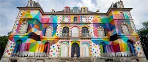 Artist Okuda San Miguel transformed a castle into a rainbow.